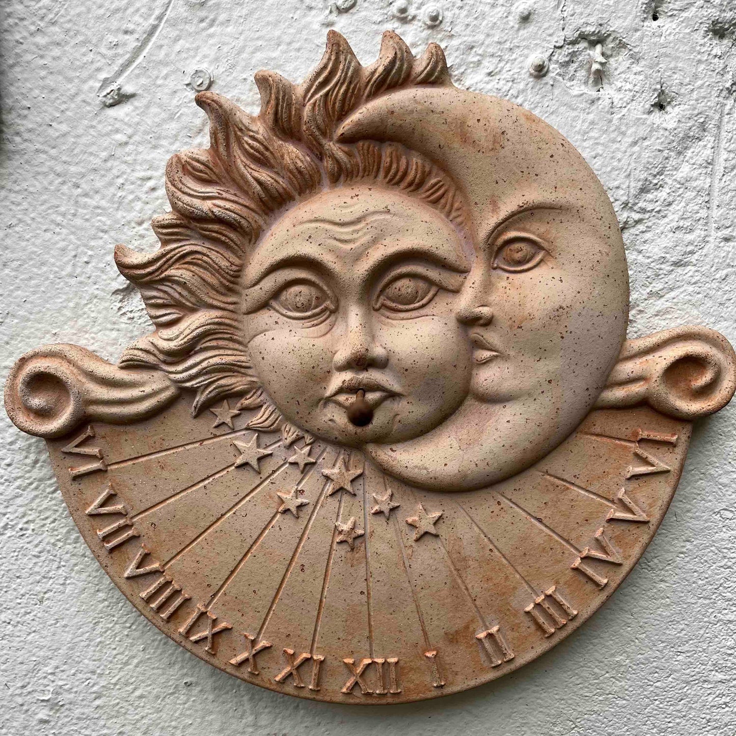 Sundial with sun and moon